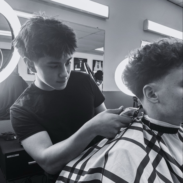 HairByHairison cutting a client's hair
