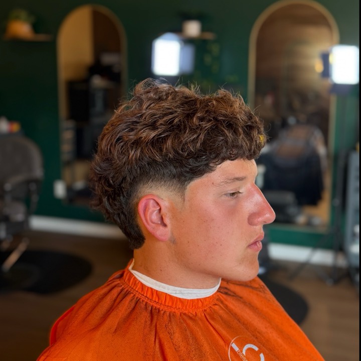 Textured crop with a mid taper fade