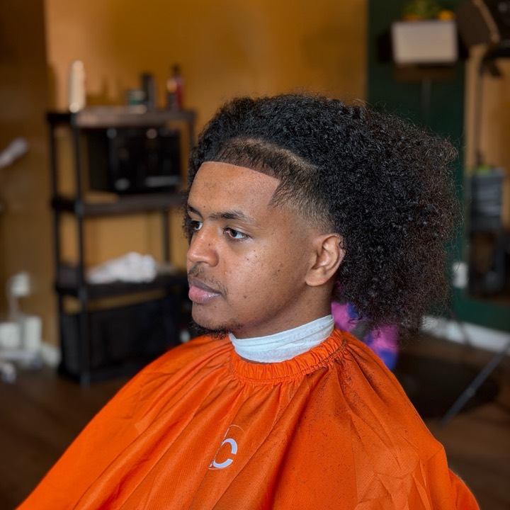 Curly top with a precision taper