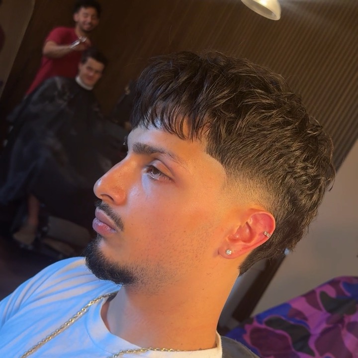 Curly fringe with a blended fade
